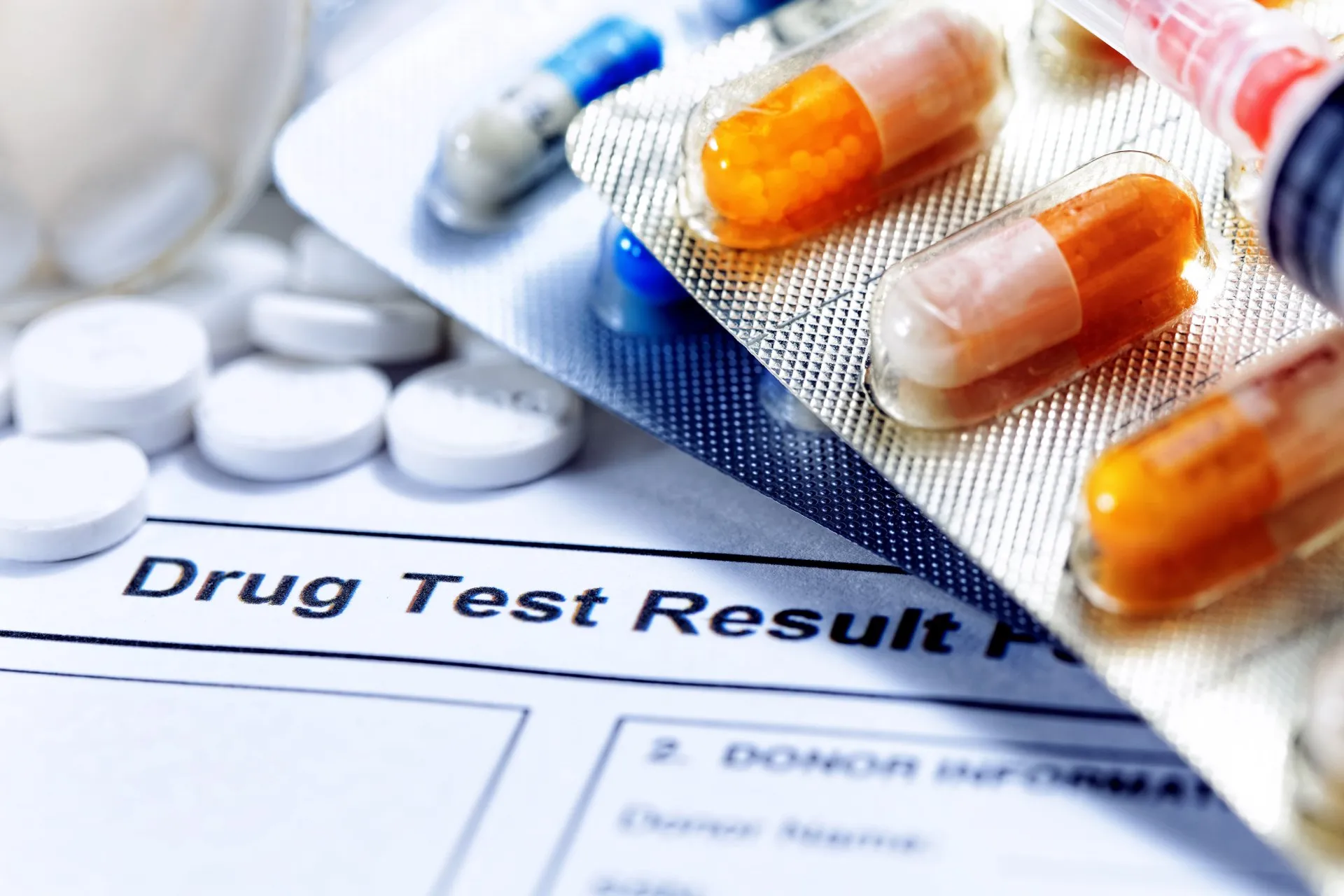 stock-photo-syringe-with-glass-vials-and-medications-pills-drug-test-report-228978439-1920w